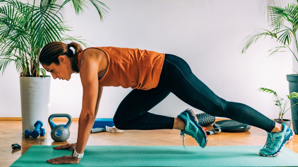 A woman is doing some exercise on the floor