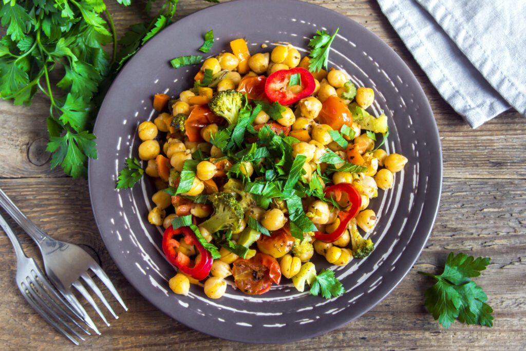vegetarian stew with chickpeas A plate of food that is on the table.